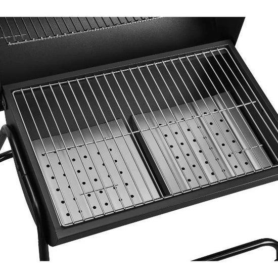 Black outdoor GRILLMEISTER Kansas Charcoal Barrel BBQ Grill with metal grates on a white background