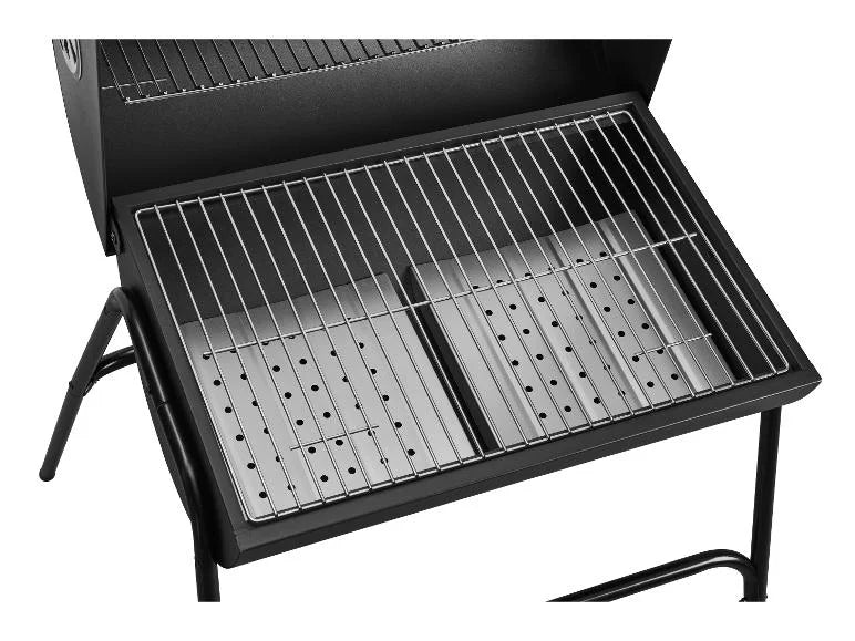 Black outdoor GRILLMEISTER Kansas Charcoal Barrel BBQ Grill with metal grates on a white background