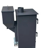A black metal outdoor waste or composting container with a slotted lid, side hopper, and cylindrical top opening, photographed on a concrete floor.