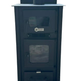 A black metal wood-burning stove or fireplace with two glass-front doors and a top handle, photographed outdoors on a paved surface with cars and a wall blurred in the background.