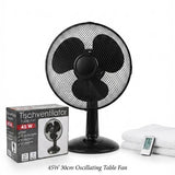 A 45W black oscillating table fan shown with its retail box, folded white towels, and a small remote control on a plain white background.
