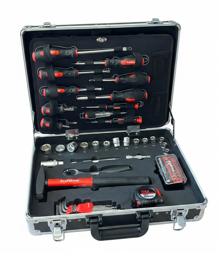 A comprehensive screwdriver and socket wrench set organized inside an open silver aluminum carrying case on a wooden floor. The tools feature black and red handles, with the brand name 'Craftsman' visible on several pieces.