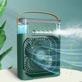 A portable green misting fan with a top handle, shown with water level and mist output illustrated on a light blue background with decorative leaves.