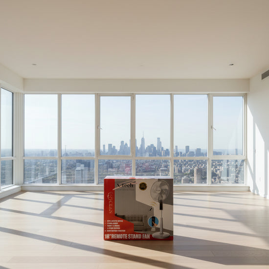 X-Tech 18-inch remote stand fan retail box on a wooden floor, showing the fan, features, and remote control graphic.