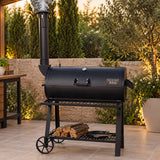 Abou Che3le BBQ Jabal El Sheikh heavy-duty black charcoal and wood smoker grill with chimney on an outdoor patio